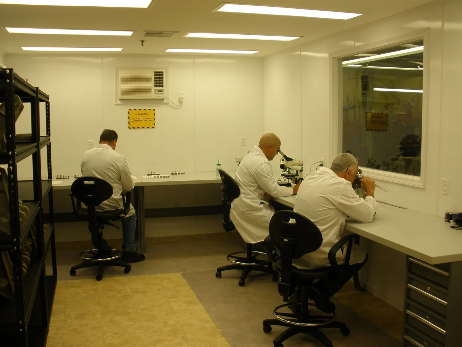 TEK Precision technicians at work in the bonding facility